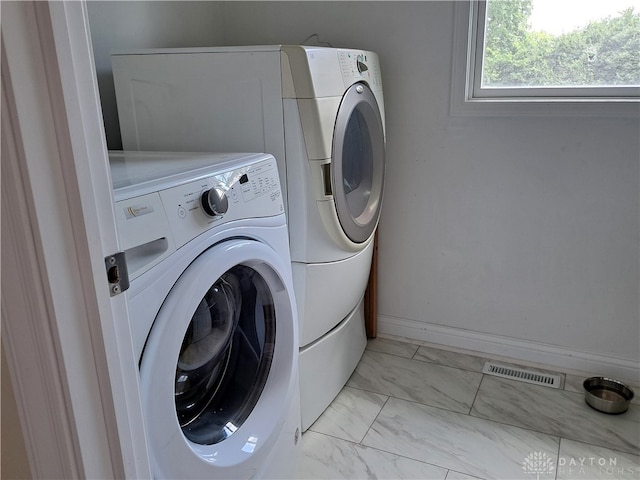 clothes washing area featuring washing machine and clothes dryer