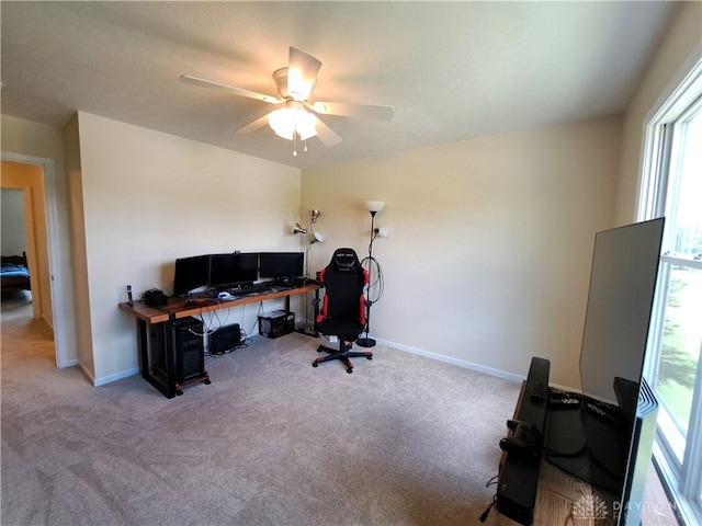 office space with ceiling fan and light colored carpet