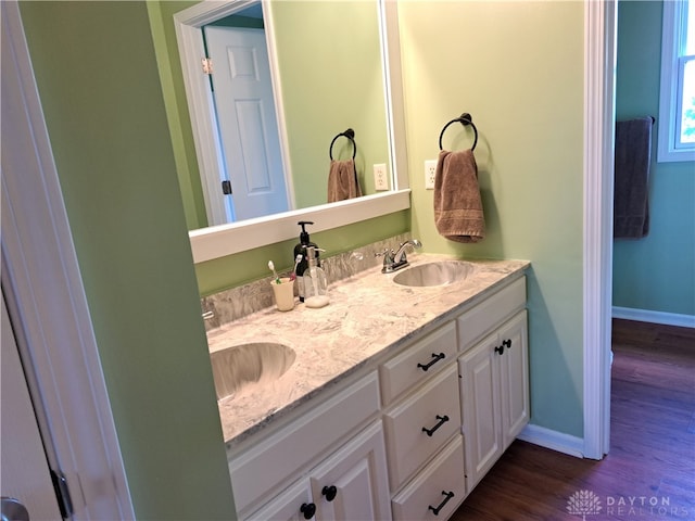 bathroom with vanity and hardwood / wood-style floors