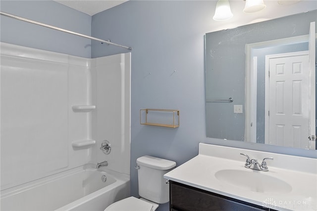 full bathroom with shower / bathing tub combination, toilet, and vanity