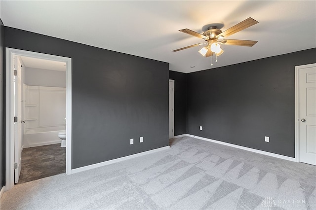 carpeted empty room with ceiling fan