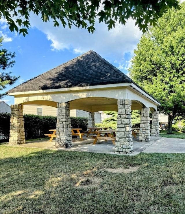 view of property's community with a yard and a gazebo