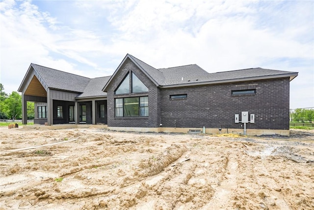 4870 Bunnell Hill Rd, Lebanon, OH 45036 - rear view of property featuring brick siding and a shingled roof