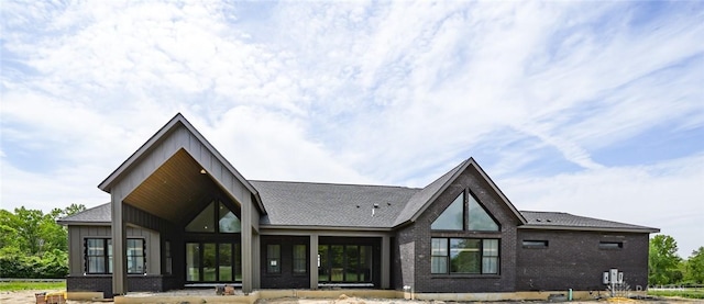 4870 Bunnell Hill Rd, Lebanon, OH 45036 - rear view of property featuring board and batten siding and brick siding