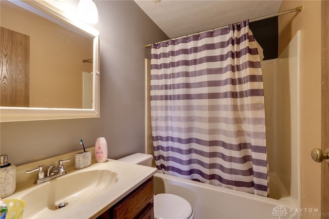 full bathroom with toilet, shower / tub combo, vanity, and a textured ceiling