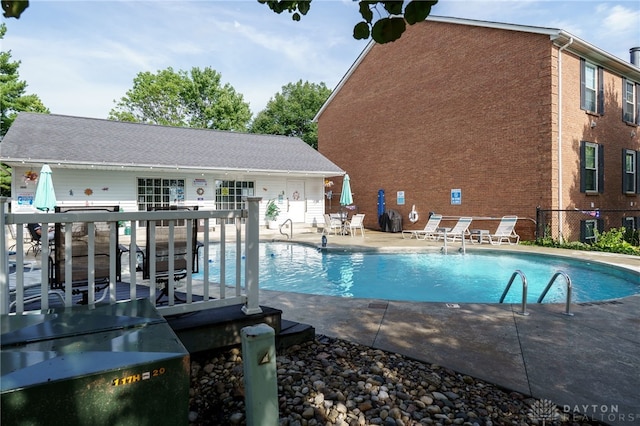 view of pool with a patio area