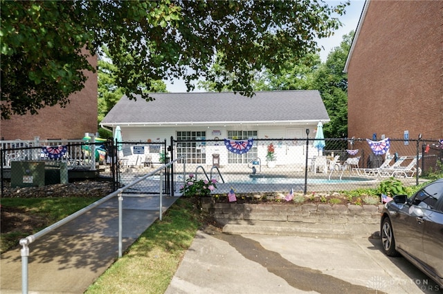 bungalow-style house with a community pool