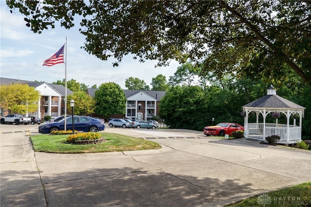 view of car parking featuring a gazebo