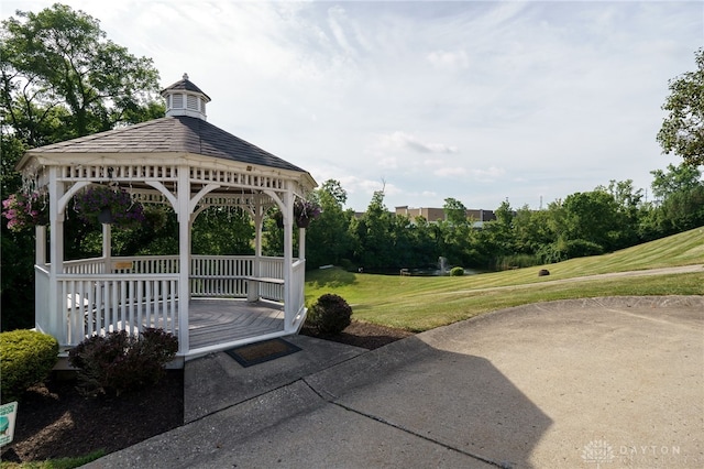 view of property's community with a gazebo and a yard