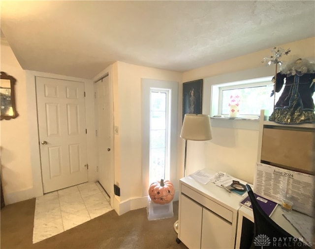 interior space featuring light tile patterned flooring