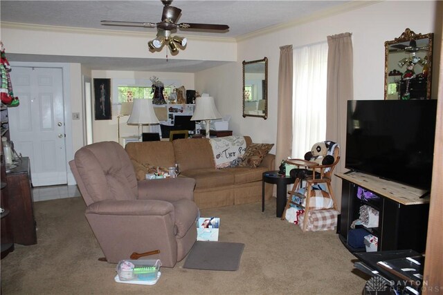 carpeted living room with ceiling fan