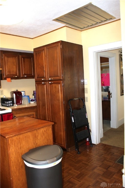 kitchen featuring dark parquet floors