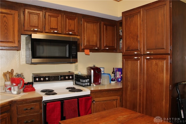 kitchen featuring white electric range oven