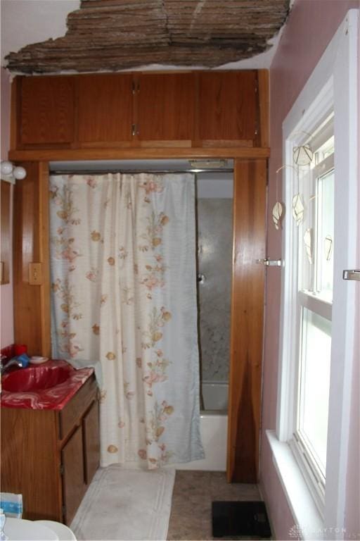 bathroom with shower / bathtub combination with curtain