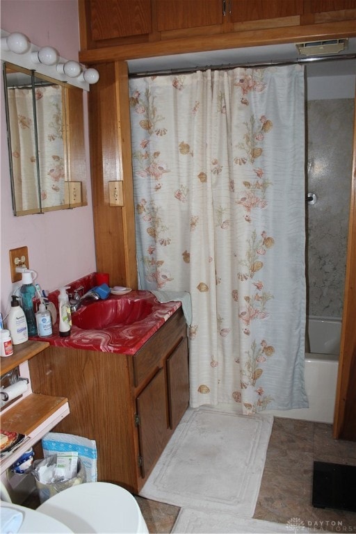 full bathroom with sink, toilet, tile patterned flooring, and shower / tub combo