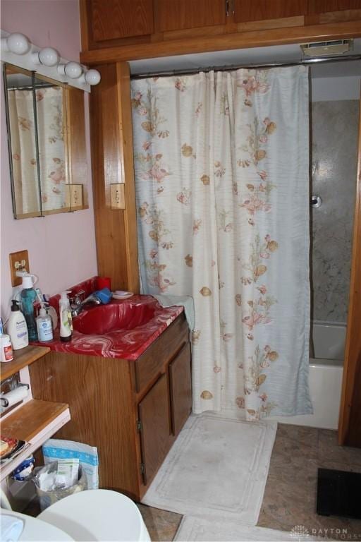 bathroom featuring vanity and shower / tub combo