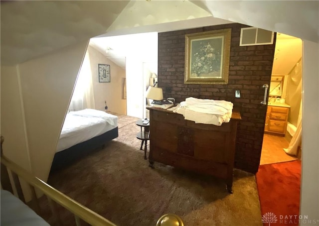 bedroom with carpet floors and vaulted ceiling