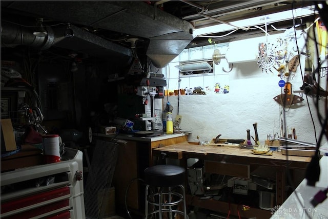 bar featuring wooden counters and a workshop area