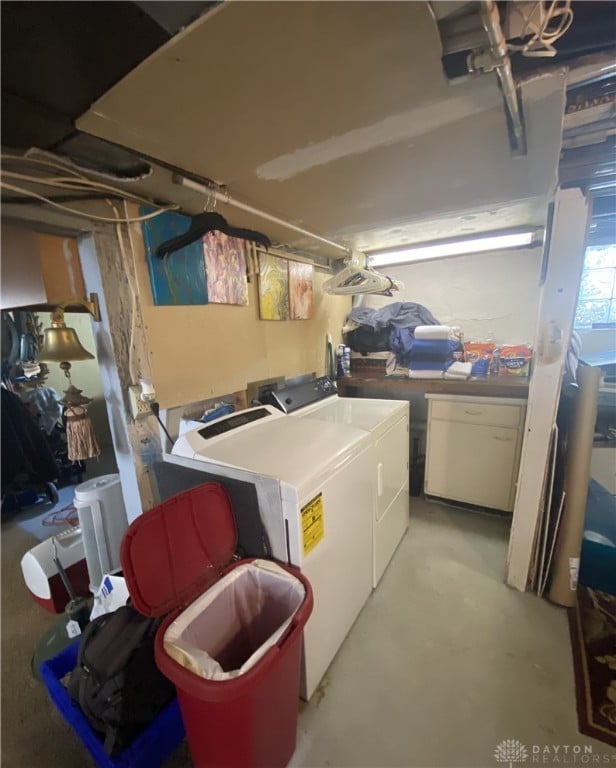 laundry area with independent washer and dryer