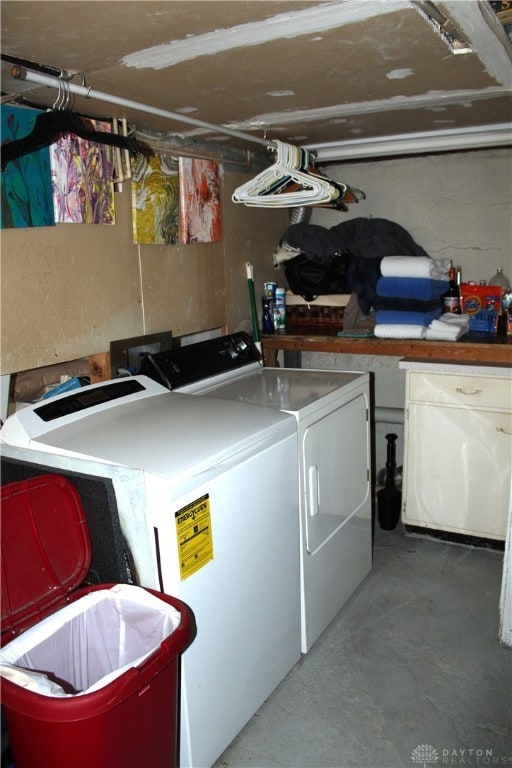 laundry area with washing machine and dryer