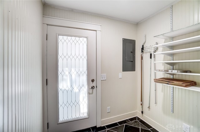 tiled foyer entrance with crown molding and electric panel