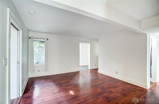 empty room featuring dark hardwood / wood-style floors