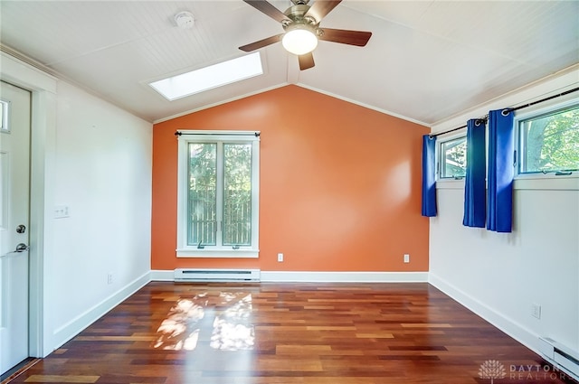 spare room featuring dark hardwood / wood-style flooring, lofted ceiling with skylight, ceiling fan, and a baseboard heating unit