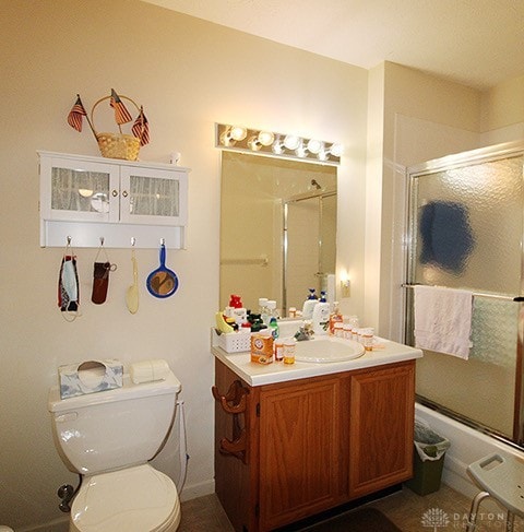 bathroom with toilet and vanity