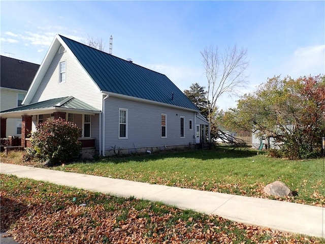 view of side of home featuring a lawn