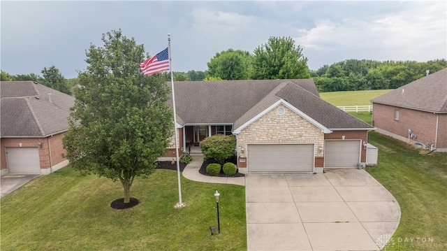 view of front of house with a garage and a front yard