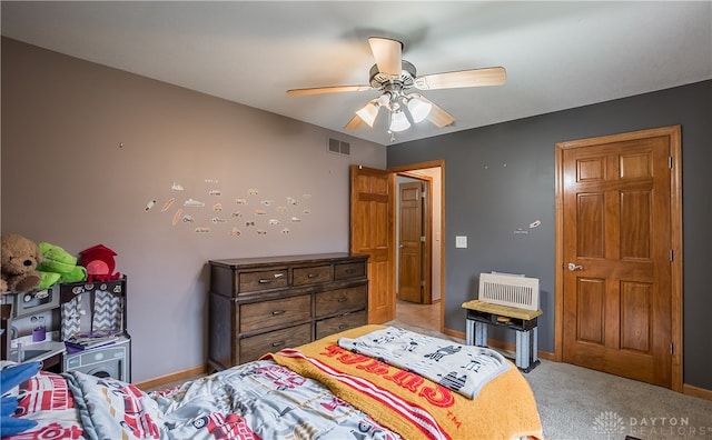 carpeted bedroom with ceiling fan