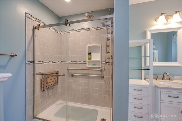 bathroom with vanity and shower / bath combination with glass door