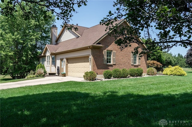 view of front of home featuring a garage and a front lawn