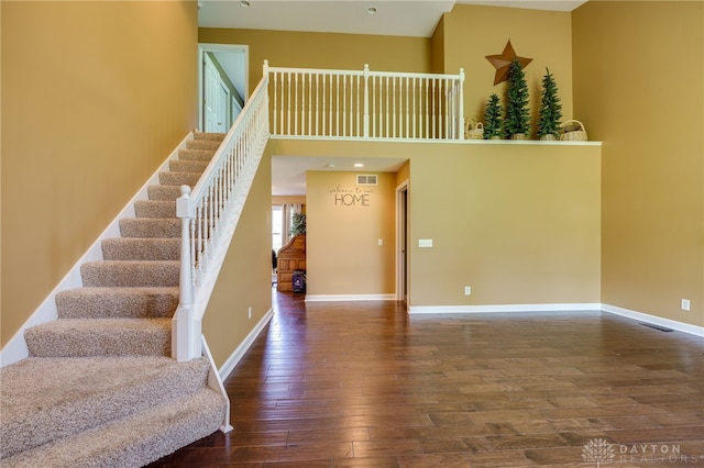 stairs with wood-type flooring