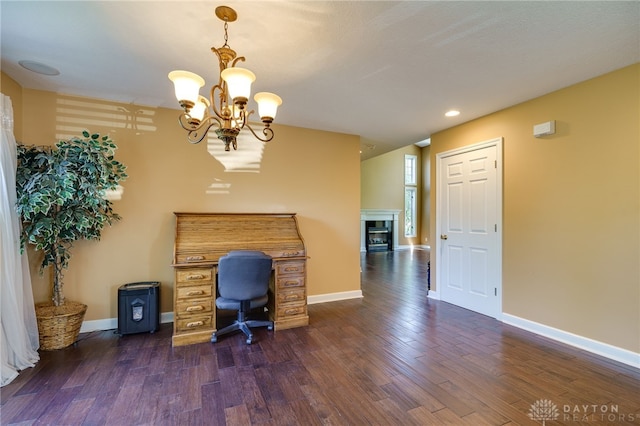 unfurnished office featuring dark hardwood / wood-style floors and a chandelier