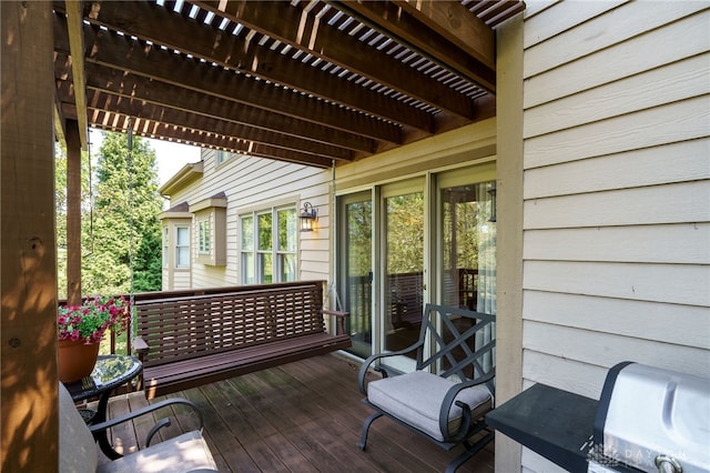 deck featuring area for grilling and a pergola