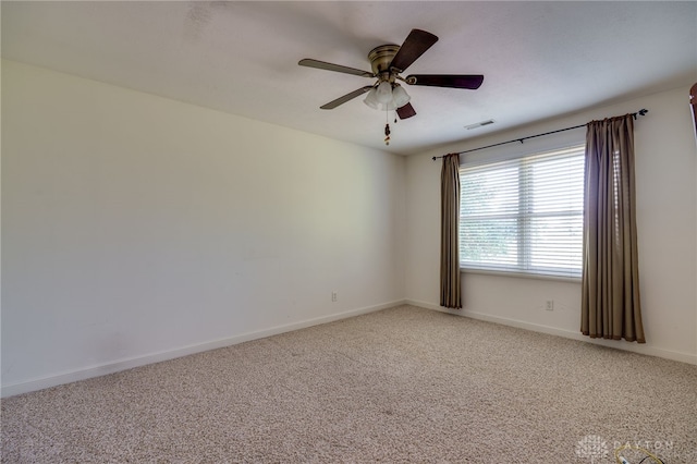 carpeted empty room featuring ceiling fan