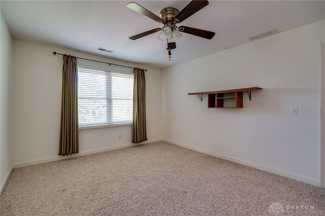 carpeted empty room with ceiling fan