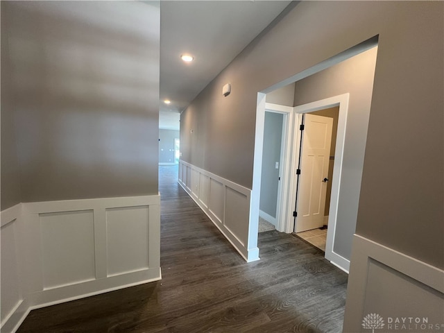 corridor with dark wood-type flooring