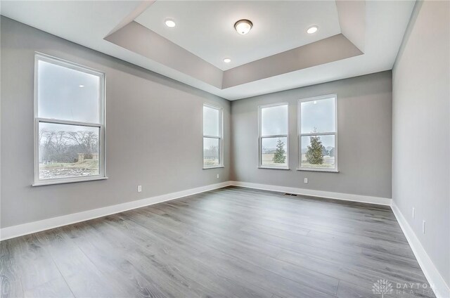 500 Creekside Ln, Lebanon, OH 45036 - unfurnished room featuring a raised ceiling, wood finished floors, visible vents, and baseboards