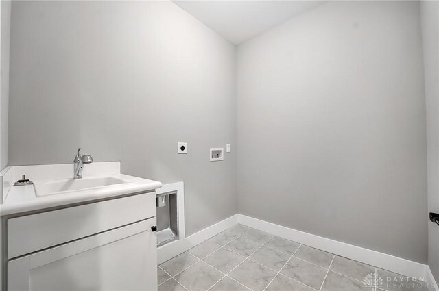 500 Creekside Ln, Lebanon, OH 45036 - washroom with baseboards, washer hookup, a sink, hookup for an electric dryer, and cabinet space