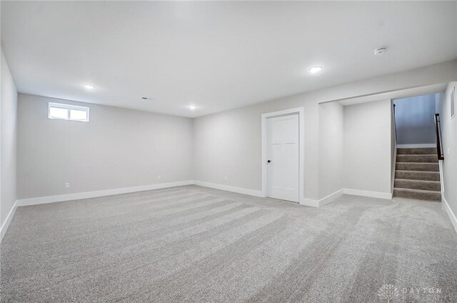 500 Creekside Ln, Lebanon, OH 45036 - below grade area featuring light carpet, baseboards, and stairway