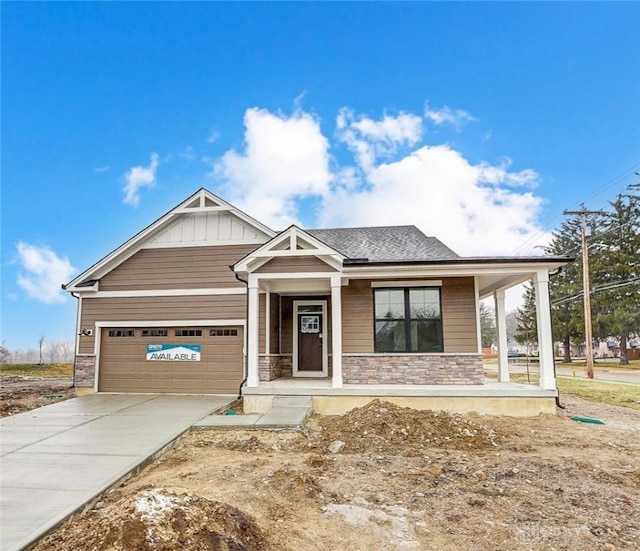 view of front of property with a porch and a garage