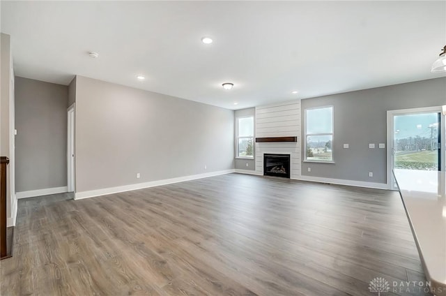 500 Creekside Ln, Lebanon, OH 45036 - unfurnished living room featuring baseboards, a large fireplace, wood finished floors, and recessed lighting