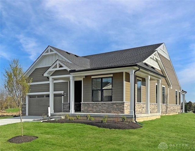 500 Creekside Ln, Lebanon, OH 45036 - view of front facade with concrete driveway, a front lawn, stone siding, and board and batten siding