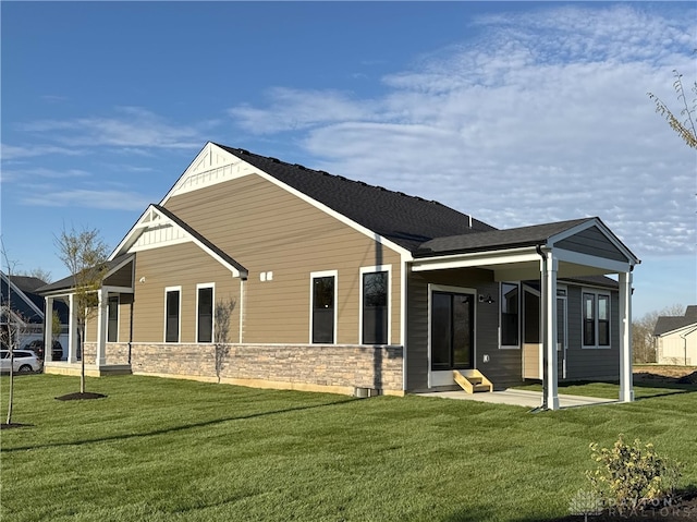 500 Creekside Ln, Lebanon, OH 45036 - rear view of house with a yard, a patio area, stone siding, and entry steps