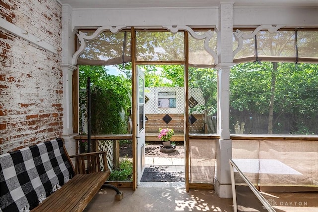 unfurnished sunroom featuring a wealth of natural light