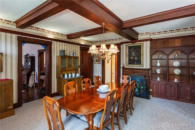 carpeted dining space featuring beamed ceiling, ornamental molding, and a chandelier