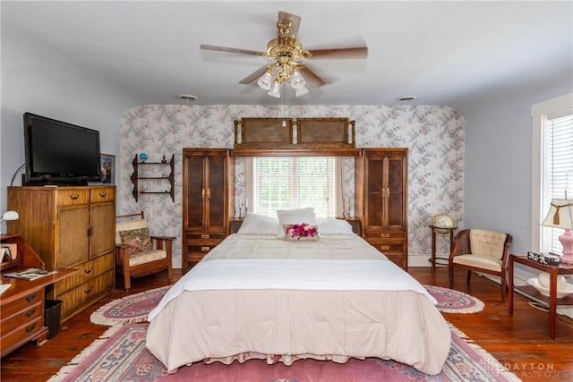 bedroom featuring ceiling fan and dark hardwood / wood-style floors