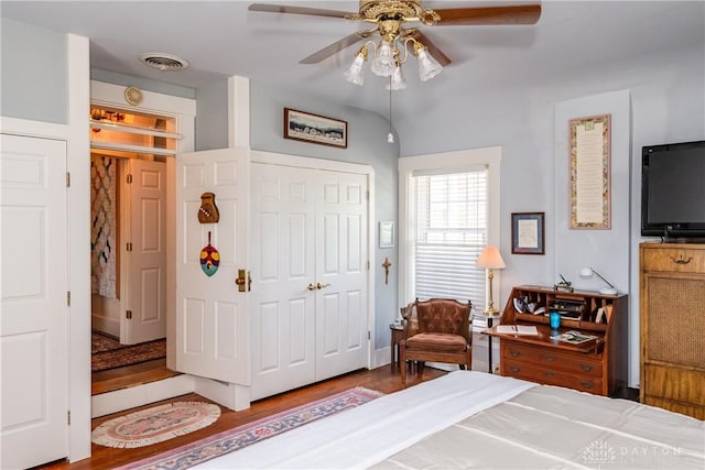 bedroom featuring ceiling fan, a closet, and wood-type flooring